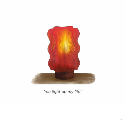 The REEF Table Lamp (Amber) & Card Gift Set features a red and orange abstract lamp on a brown base, accompanied by a card with "You light up my life!" Perfect for a romantic gesture or thoughtful gift.